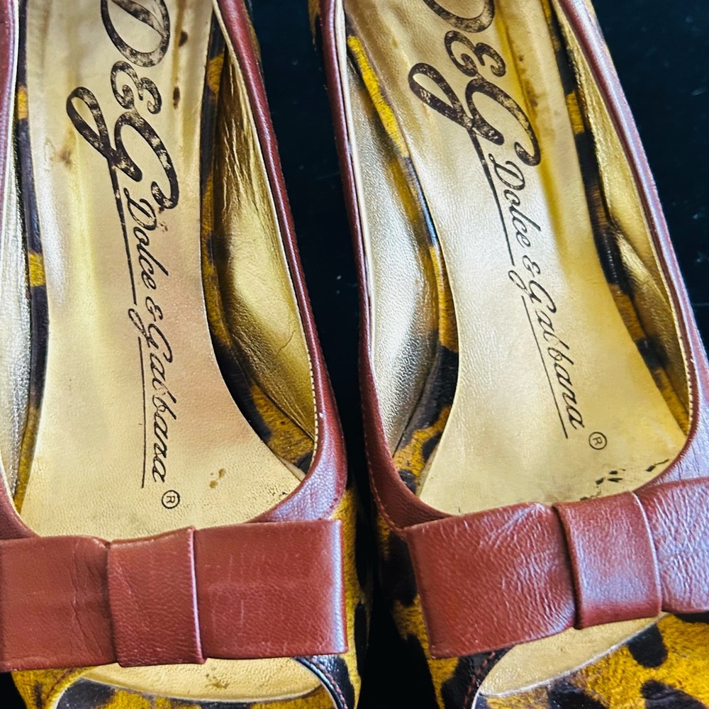 Dolce & Gabbana Leopard Print Pumps with Red Bow Accents